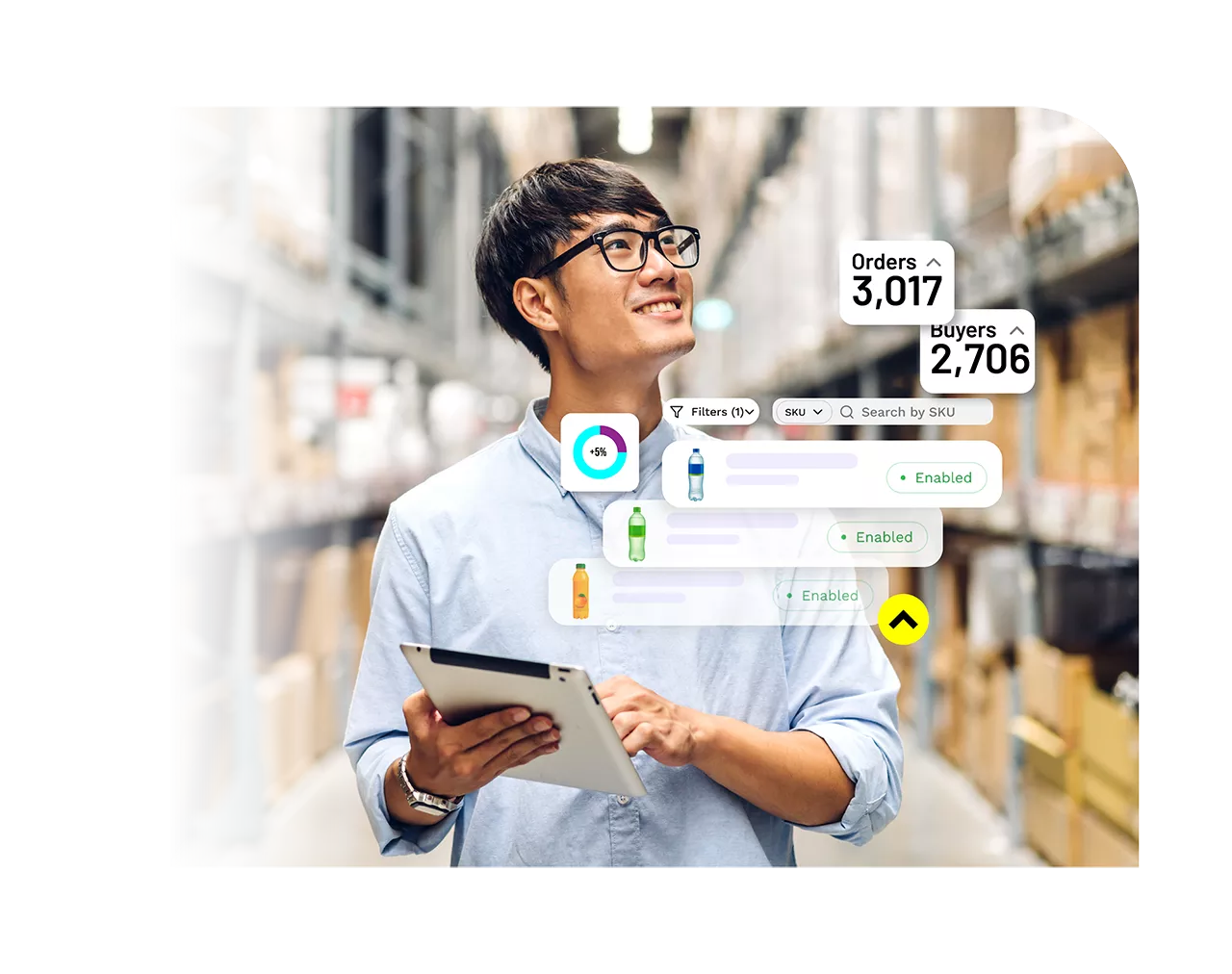A man using a tablet to view orders and buyers at a warehouse.