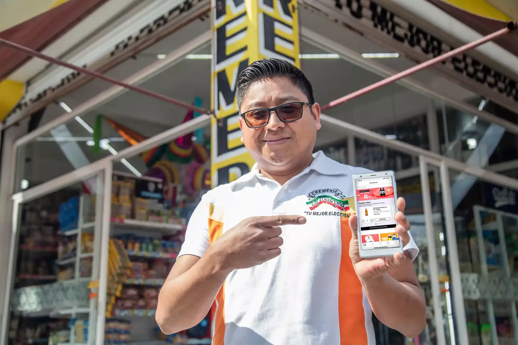 A man showing a delivery app of drinks A man showing a delivery app of drinks